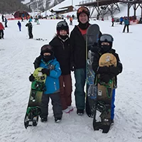 Cosmetic dentist Dr. Scott Harris and family snowboarding