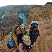 Phoenix cosmetic dentist Dr. Scott Harris and family hiking near a stream