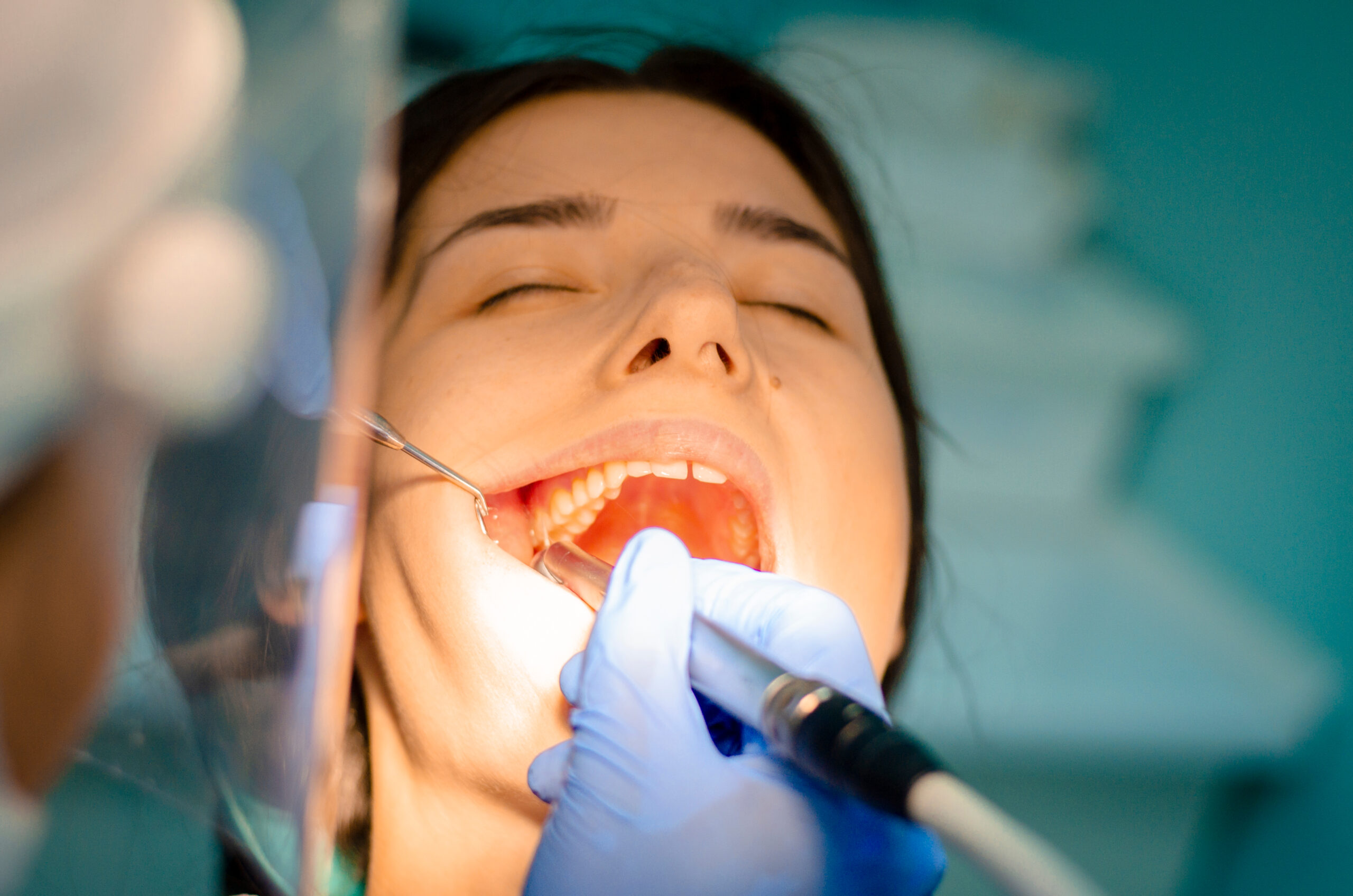 dentist checking a patients tooth for infection