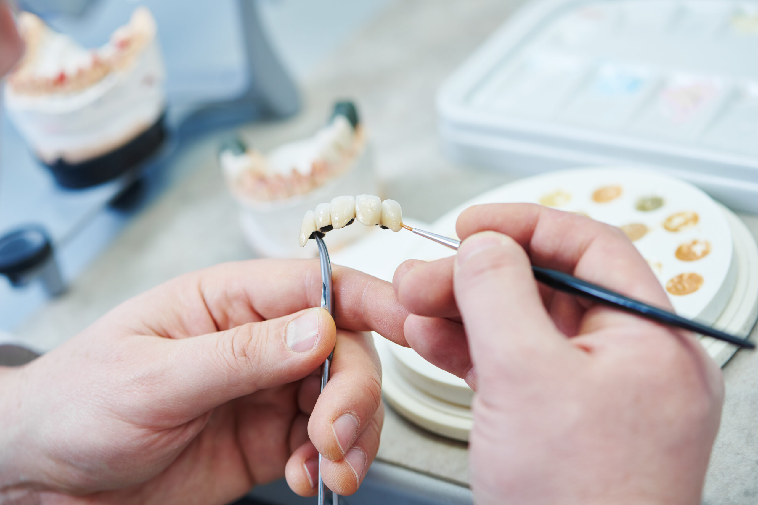 dental tech working on a dental bridge