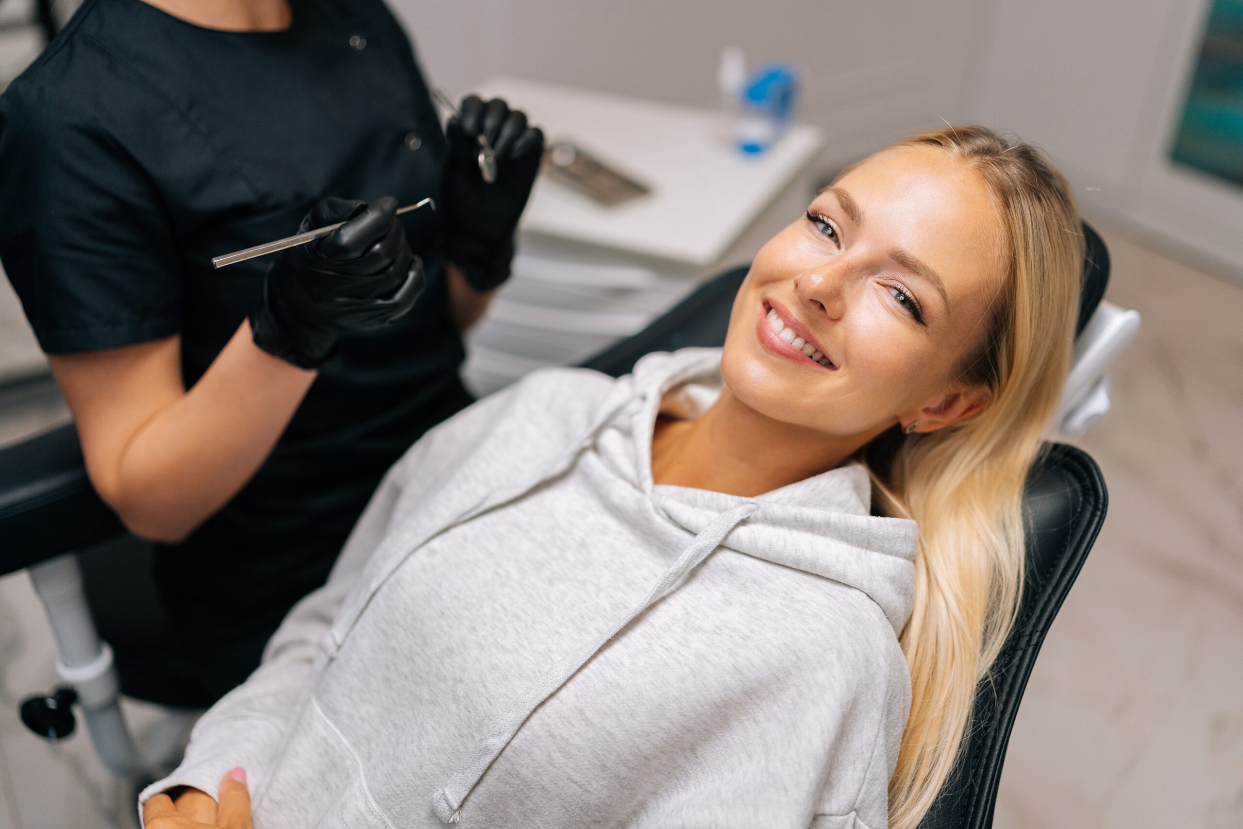 relaxed young woman sitting in a dental chair